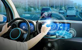 Modern car dashboard showing safety features and a clear road ahead